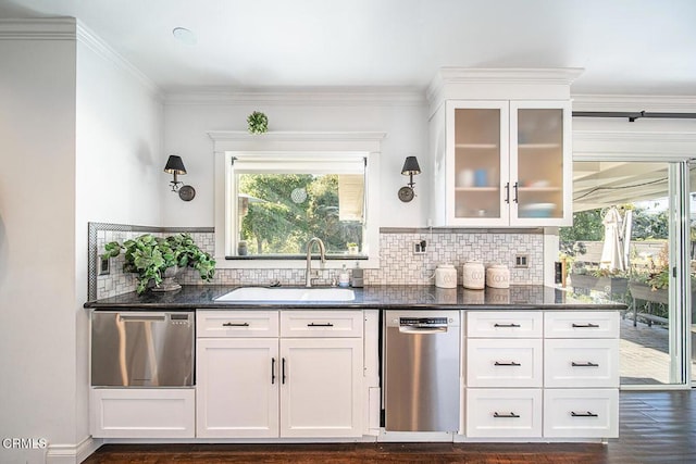 bar featuring stainless steel dishwasher, dark wood-style floors, a sink, and decorative backsplash