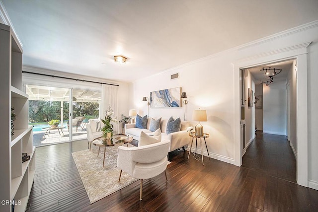 bedroom featuring access to outside, crown molding, visible vents, hardwood / wood-style floors, and baseboards