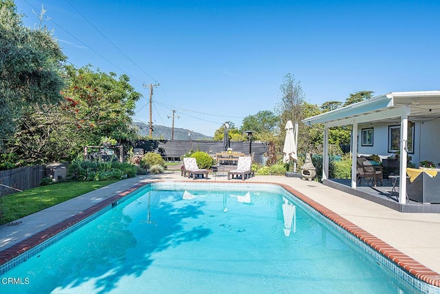 view of swimming pool featuring a fenced backyard, a fenced in pool, and a patio