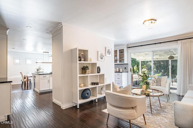 dining space with dark wood-type flooring, plenty of natural light, and crown molding