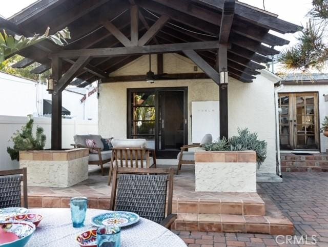 exterior space featuring outdoor lounge area and a gazebo