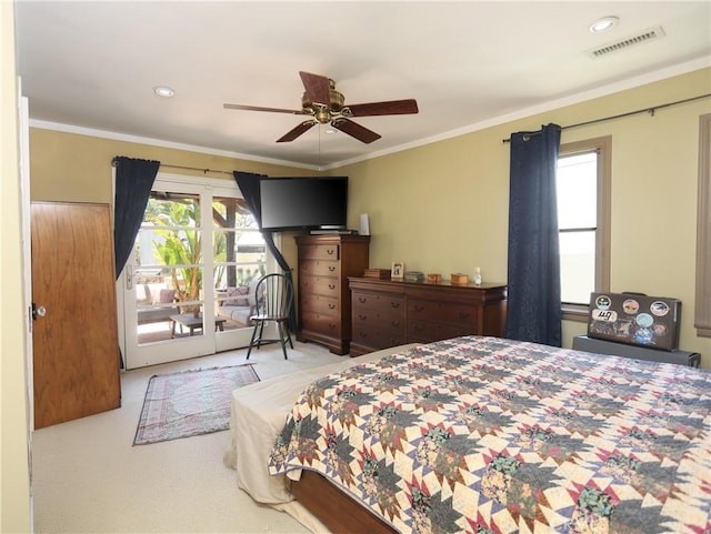 carpeted bedroom featuring access to outside, visible vents, multiple windows, and ornamental molding