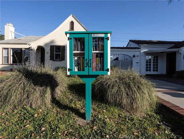 view of front of home with french doors and stucco siding