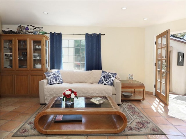 living room featuring a wealth of natural light, recessed lighting, and light tile patterned floors
