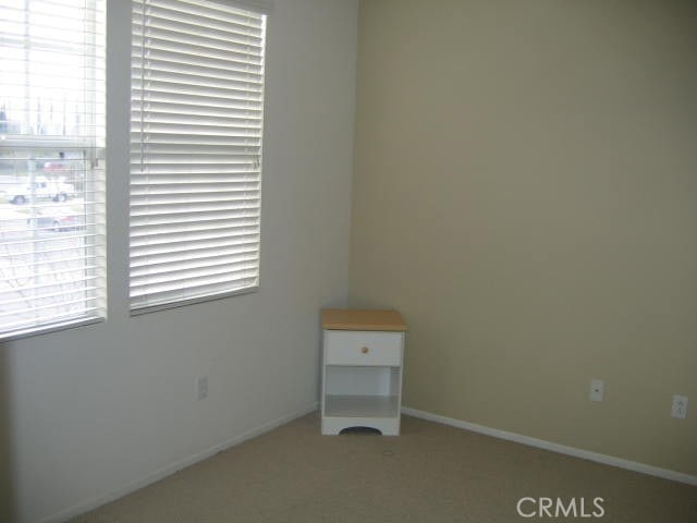 1590 River Wood Ct, Simi Valley, CA 93063 - carpeted empty room with baseboards