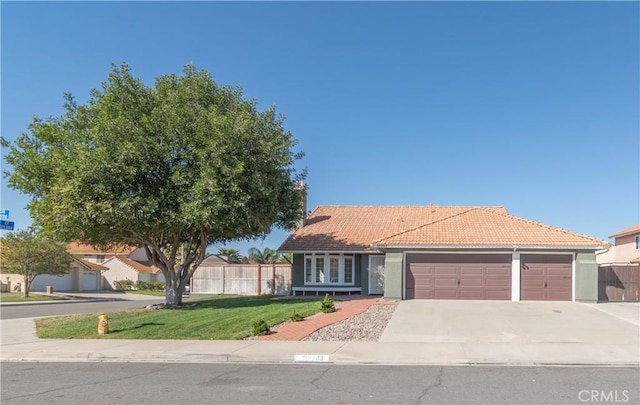 39203 Foxglove Cir, Murrieta, CA 92563 - single story home with an attached garage, a tile roof, fence, a front lawn, and driveway