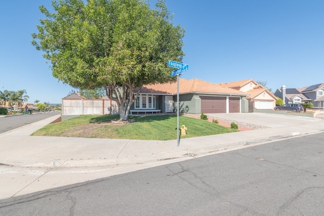 39203 Foxglove Cir, Murrieta, CA 92563 - view of front of property featuring a front yard, driveway, a residential view, and a garage