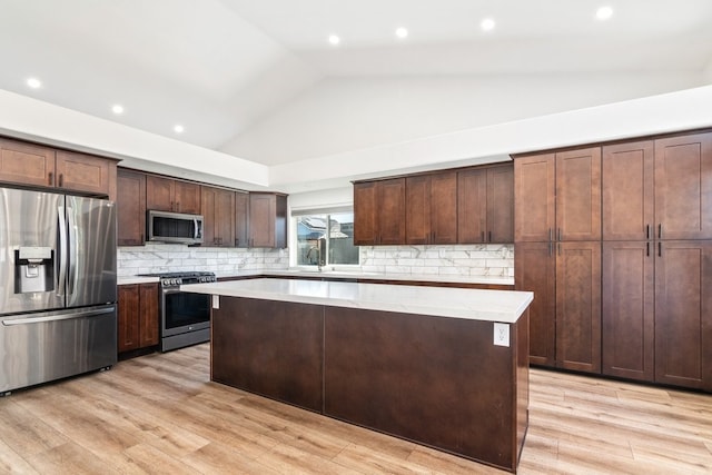 39203 Foxglove Cir, Murrieta, CA 92563 - kitchen featuring stainless steel appliances, tasteful backsplash, a sink, and a kitchen island