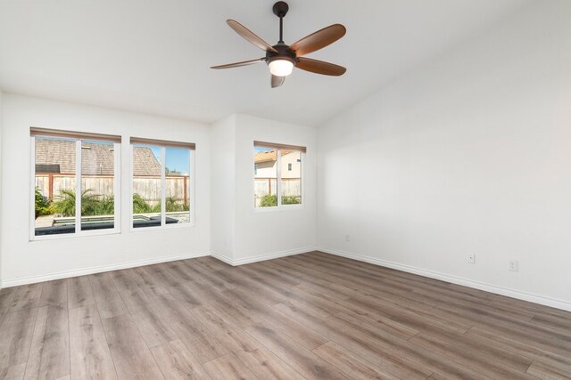 39203 Foxglove Cir, Murrieta, CA 92563 - empty room with wood finished floors, baseboards, a ceiling fan, and lofted ceiling