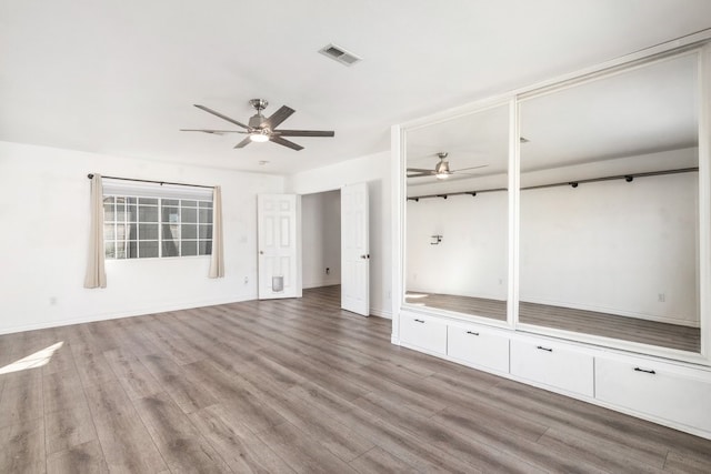 39203 Foxglove Cir, Murrieta, CA 92563 - interior space with visible vents, light wood-style flooring, a ceiling fan, and baseboards