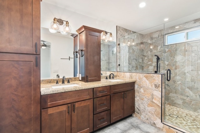 39203 Foxglove Cir, Murrieta, CA 92563 - full bathroom featuring a sink, a shower stall, and double vanity