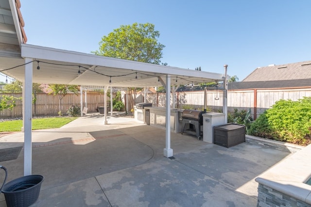 39203 Foxglove Cir, Murrieta, CA 92563 - view of patio / terrace with exterior kitchen, a fenced backyard, and area for grilling