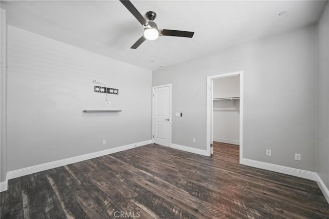 41908 Sonoma Rd, Palmdale, CA 93551 - unfurnished bedroom with wood finished floors, a walk in closet, a closet, and ceiling fan