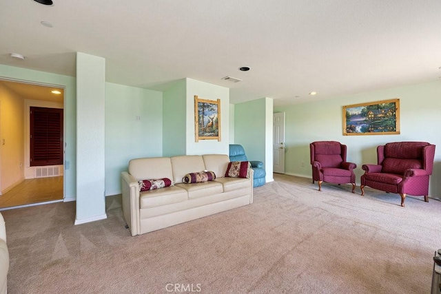 living room featuring recessed lighting, carpet, visible vents, and baseboards
