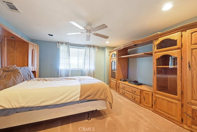 bedroom with visible vents, recessed lighting, light colored carpet, and a ceiling fan