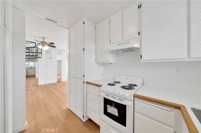 kitchen with ceiling fan, electric range, visible vents, under cabinet range hood, and light countertops