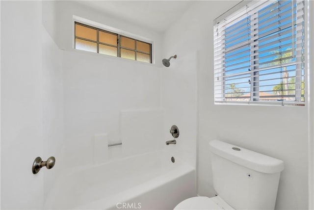 full bath featuring toilet and washtub / shower combination