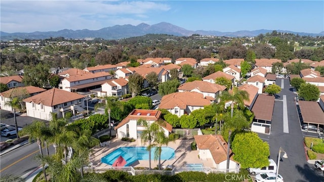 birds eye view of property with a mountain view and a residential view