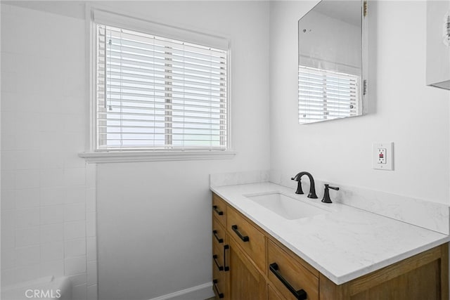 bathroom featuring vanity and a healthy amount of sunlight
