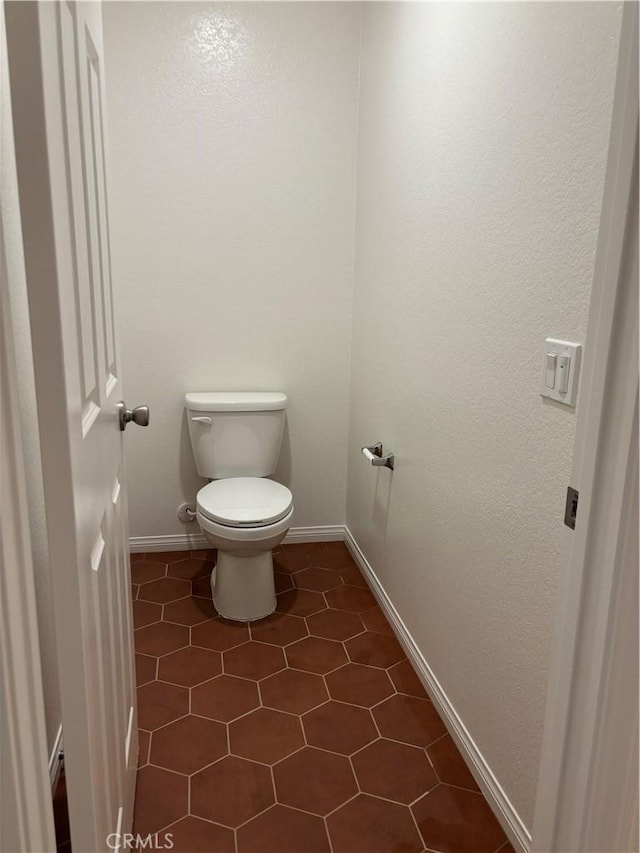 19427 Seeding Palace Cir, Riverside, CA 92507 - bathroom featuring toilet, baseboards, and tile patterned flooring