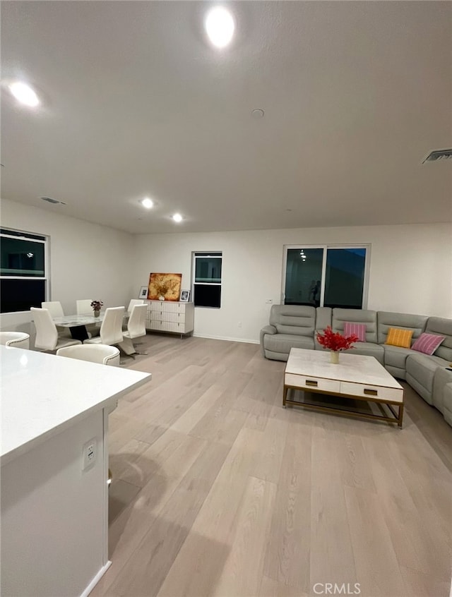 19427 Seeding Palace Cir, Riverside, CA 92507 - living room featuring light wood-type flooring, recessed lighting, and baseboards