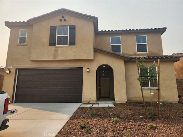 19427 Seeding Palace Cir, Riverside, CA 92507 - view of front of home with a tile roof, a garage, stucco siding, and driveway