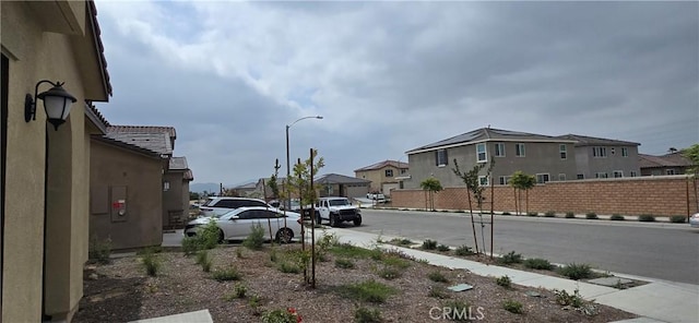 19427 Seeding Palace Cir, Riverside, CA 92507 - view of asphalt street featuring street lights, sidewalks, a residential view, and curbs