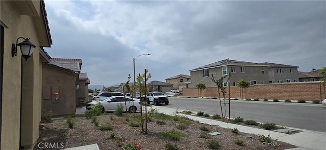 19427 Seeding Palace Cir, Riverside, CA 92507 - view of asphalt road with street lighting, sidewalks, a residential view, and curbs