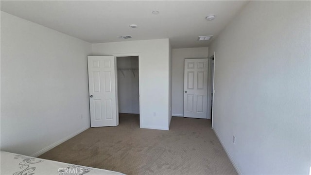 19427 Seeding Palace Cir, Riverside, CA 92507 - unfurnished bedroom featuring carpet flooring, a closet, and a walk in closet