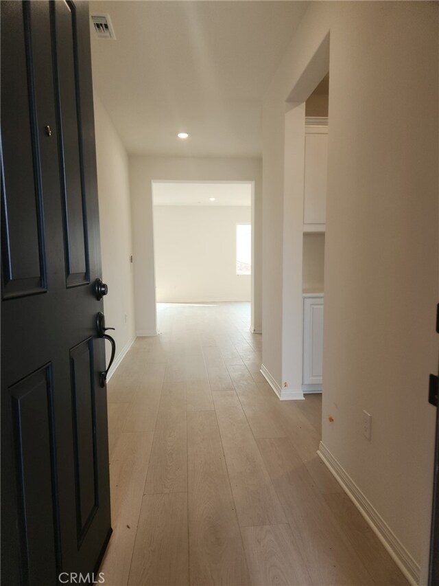 19427 Seeding Palace Cir, Riverside, CA 92507 - hall featuring light wood-style floors, recessed lighting, and baseboards