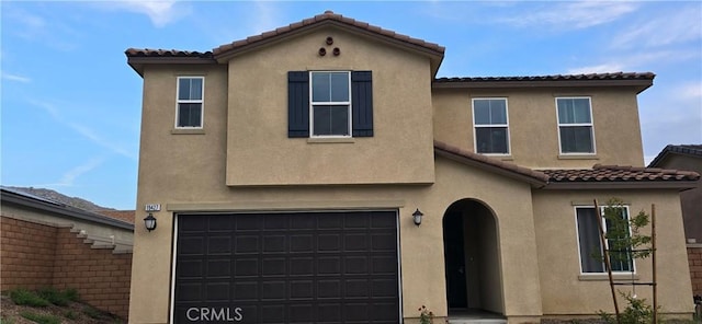 19427 Seeding Palace Cir, Riverside, CA 92507 - view of front of home with a tiled roof, a garage, stucco siding, and driveway