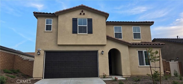 19427 Seeding Palace Cir, Riverside, CA 92507 - view of front facade with stucco siding, a tiled roof, driveway, and a garage