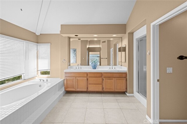 45422 Camino Monzon, Temecula, CA 92592 - full bathroom with a bath, a shower stall, tile patterned floors, double vanity, and lofted ceiling