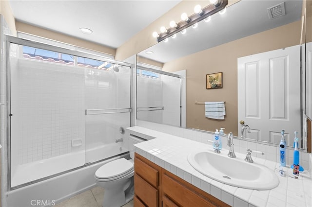 45422 Camino Monzon, Temecula, CA 92592 - full bath featuring toilet, tile patterned floors, vanity, and combined bath / shower with glass door