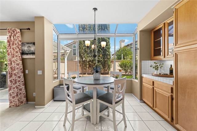 45422 Camino Monzon, Temecula, CA 92592 - dining space with healthy amount of natural light, light tile patterned floors, a chandelier, and baseboards