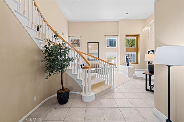 45422 Camino Monzon, Temecula, CA 92592 - staircase featuring a chandelier, baseboards, and tile patterned flooring