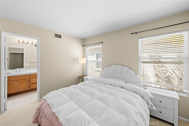45422 Camino Monzon, Temecula, CA 92592 - bedroom with light colored carpet, a sink, and ensuite bathroom