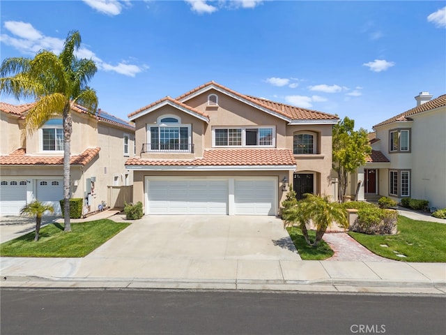 45422 Camino Monzon, Temecula, CA 92592 - mediterranean / spanish-style home featuring an attached garage, stucco siding, driveway, and a tile roof