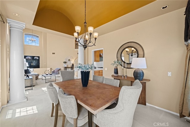 45422 Camino Monzon, Temecula, CA 92592 - dining room featuring ornate columns, a chandelier, vaulted ceiling, light carpet, and baseboards