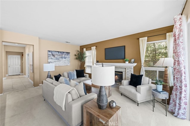 45422 Camino Monzon, Temecula, CA 92592 - living room featuring light carpet, healthy amount of natural light, a fireplace, and baseboards