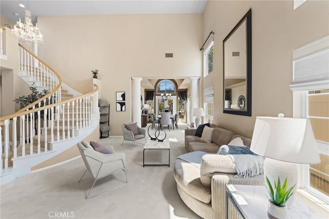 45422 Camino Monzon, Temecula, CA 92592 - carpeted living area featuring ornate columns, a chandelier, stairs, and a towering ceiling