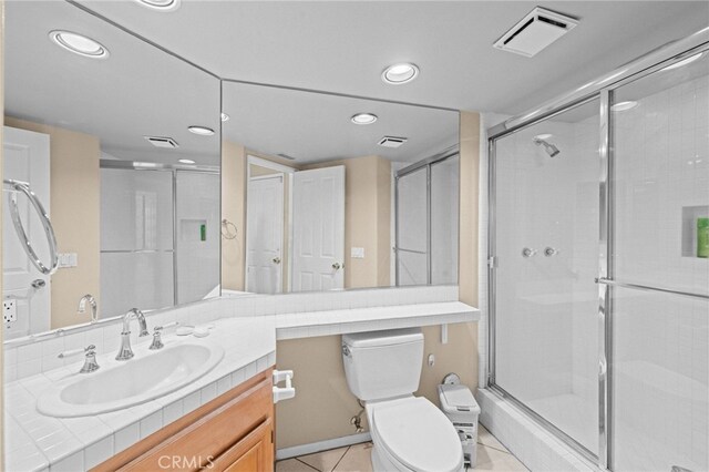 45422 Camino Monzon, Temecula, CA 92592 - bathroom featuring tile patterned flooring, a shower stall, toilet, vanity, and recessed lighting