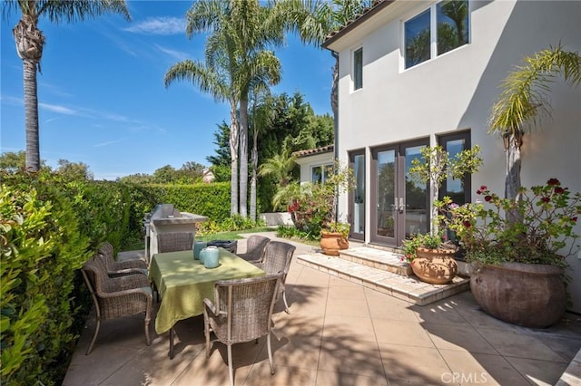 view of patio / terrace featuring french doors and outdoor dining space