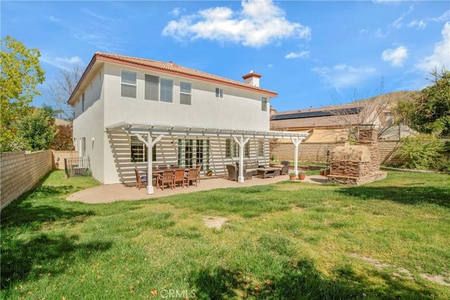28514 High Ridge Dr, Saugus, CA 91390 - back of house featuring stucco siding, a pergola, a patio area, a fenced backyard, and a yard