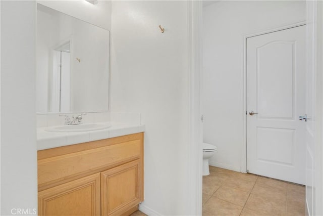 28514 High Ridge Dr, Saugus, CA 91390 - bathroom featuring tile patterned flooring, vanity, baseboards, and toilet