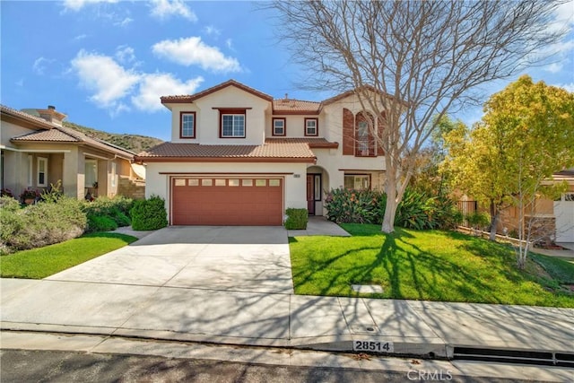 28514 High Ridge Dr, Saugus, CA 91390 - mediterranean / spanish home with an attached garage, a tiled roof, driveway, and stucco siding
