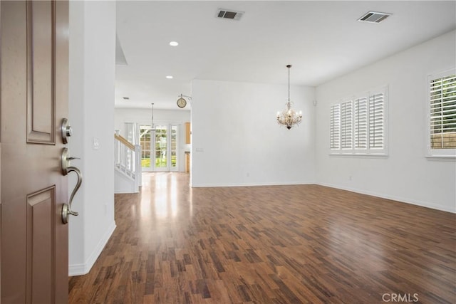 28514 High Ridge Dr, Saugus, CA 91390 - spare room with visible vents, baseboards, an inviting chandelier, and wood finished floors