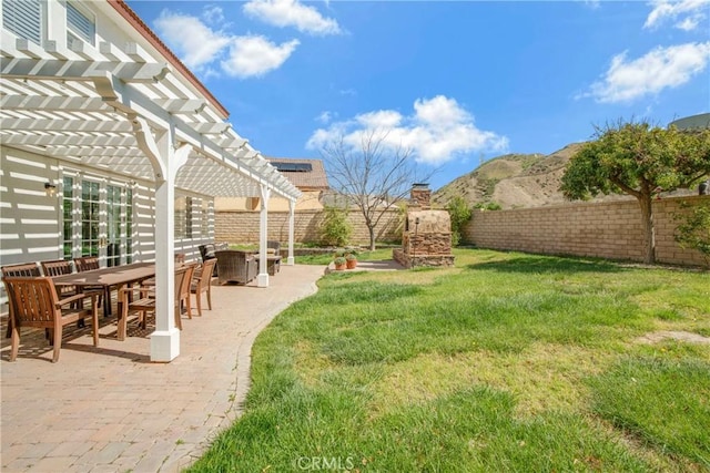 28514 High Ridge Dr, Saugus, CA 91390 - view of yard with a pergola, a fireplace, a fenced backyard, a patio area, and a mountain view
