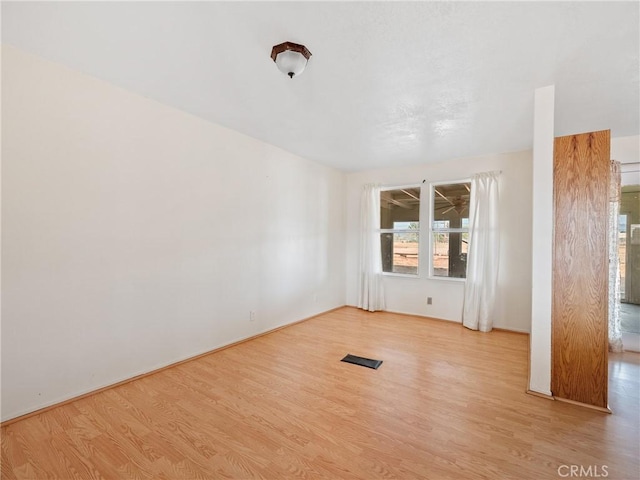 14435 Hopi Rd, Apple Valley, CA 92307 - spare room with visible vents and wood finished floors