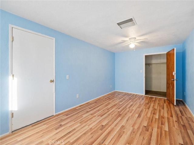 14435 Hopi Rd, Apple Valley, CA 92307 - unfurnished bedroom featuring a ceiling fan, a closet, baseboards, visible vents, and wood finished floors